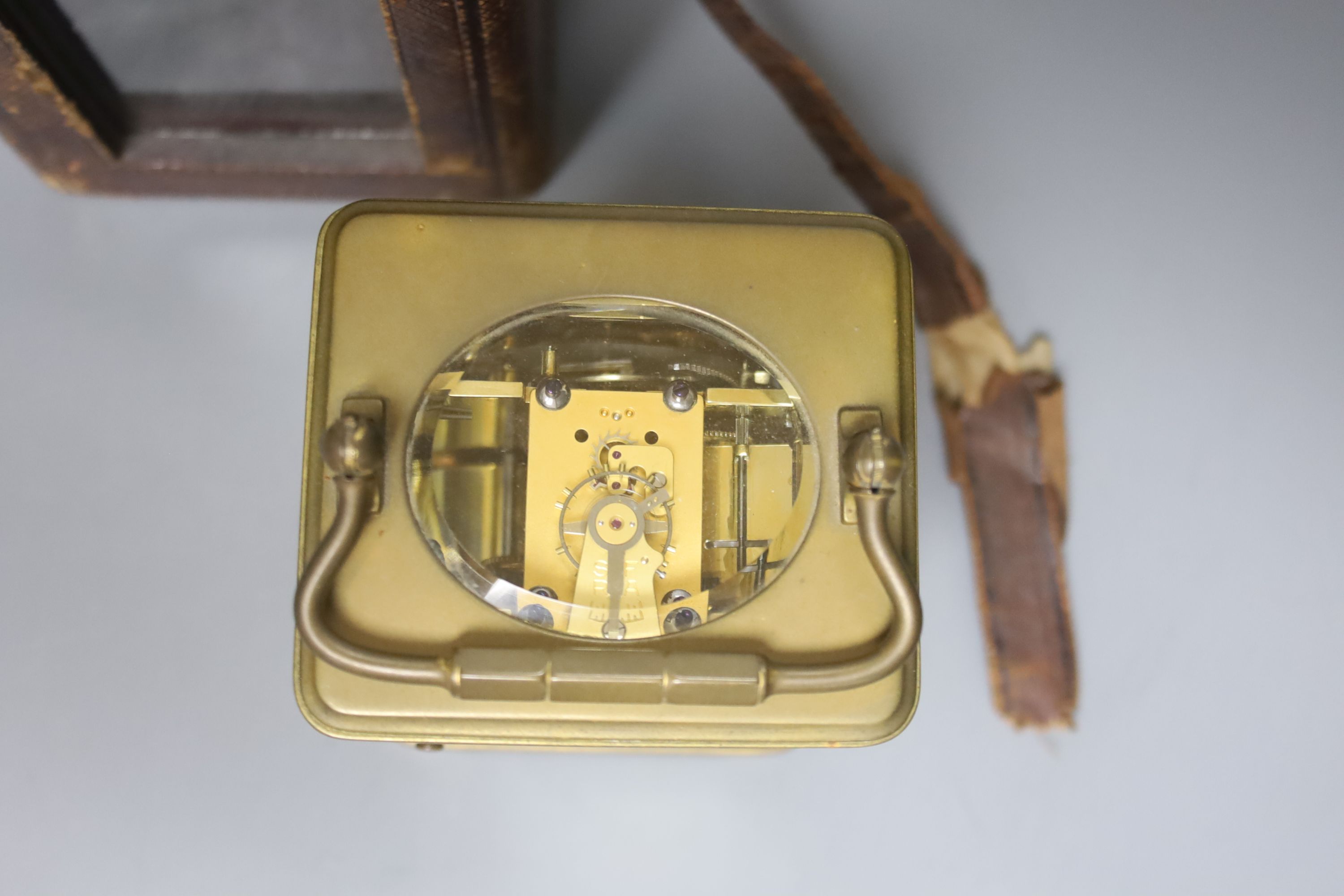 An early 20th century French lacquered brass carriage clock, with enamelled dial, cased, overall height 16cm